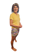 Load image into Gallery viewer, a woman in a yellow shirt and colorful shorts
