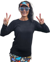 Load image into Gallery viewer, a woman wearing a black shirt and colorful shorts
