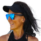 a woman with a hat and sunglasses on