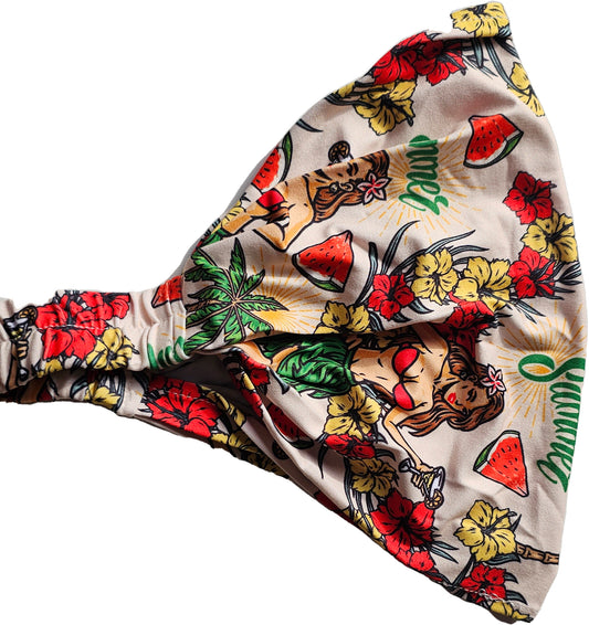 a bow tie with a hula girl hawaiian design design on it