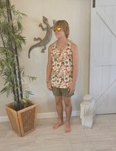 Load image into Gallery viewer, a man standing in front of a wall with a hula girl hawaiian design tank top with lizard in background
