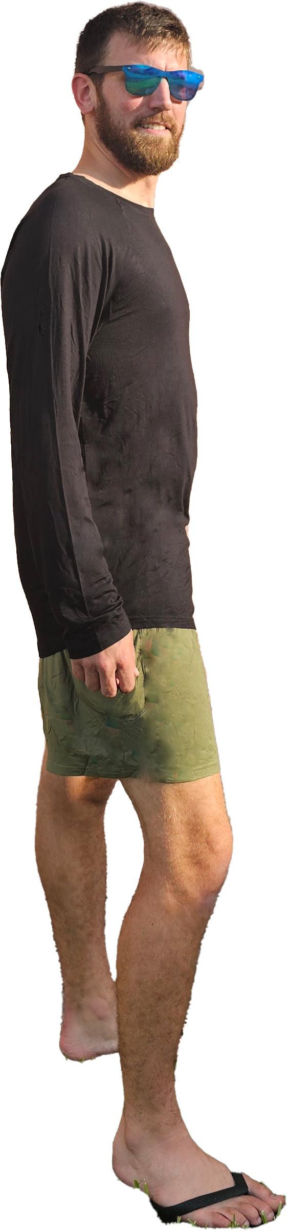 a man in a black shirt and green shorts