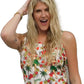 a woman with long blonde hair wearing a hula girl hawaiian design tank top 