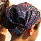 a close up of a person wearing amandala headband 