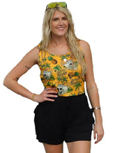 Load image into Gallery viewer, a woman wearing a yellow top and black shorts

