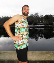Load image into Gallery viewer, a man standing in front of a body of water
