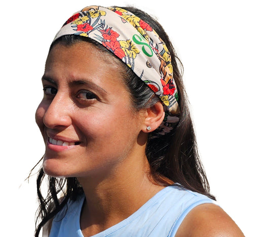a woman with a hula girl hawaiian design bandana on her head
