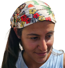 Load image into Gallery viewer, a woman wearing a hula girl hawaiian design  bandana looking down at her cell phone

