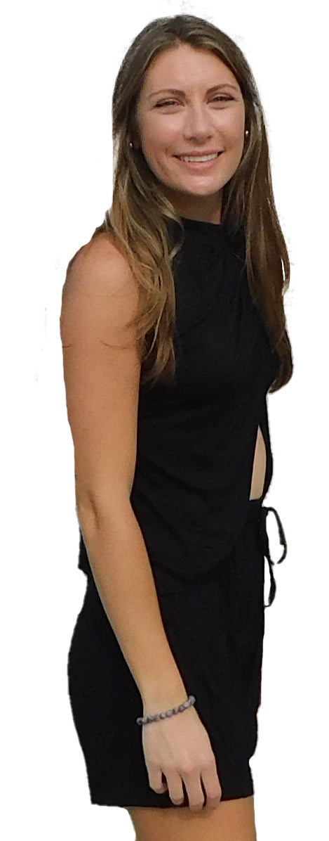 a woman in a black dress posing for a picture