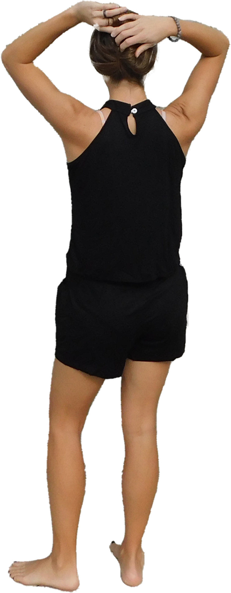a woman in black shorts and a tank top