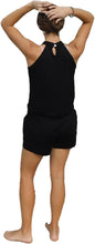 Load image into Gallery viewer, a woman in black shorts and a tank top
