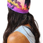 a woman wearing a Lavender island hat with palm trees on it