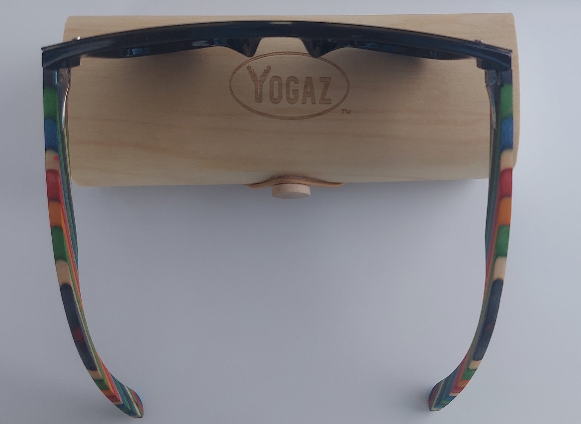 a pair of glasses with a wooden holder