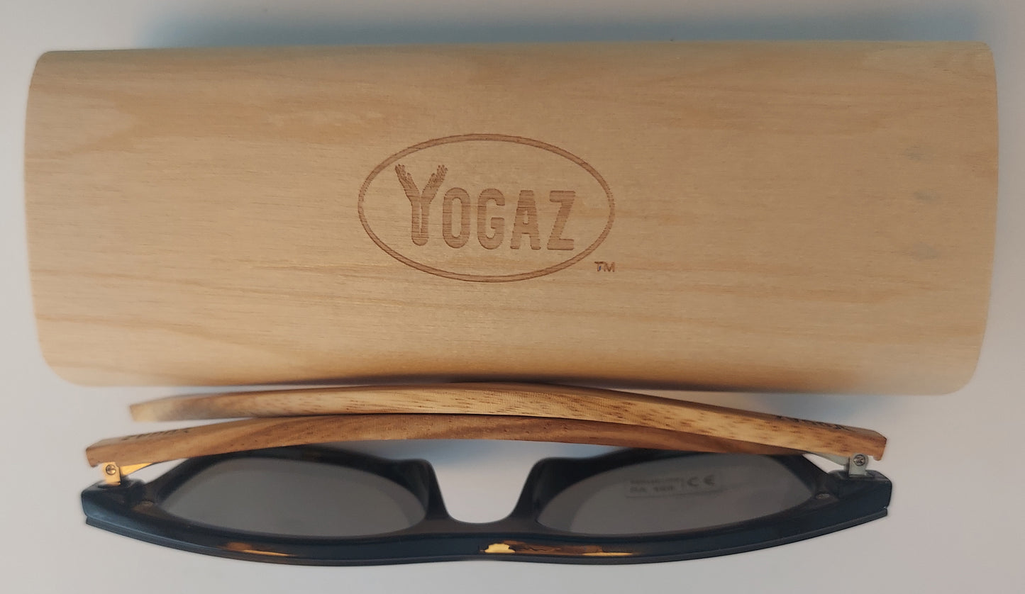 a pair of glasses sitting on top of a wooden case