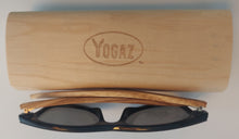 Load image into Gallery viewer, a pair of glasses sitting on top of a wooden case
