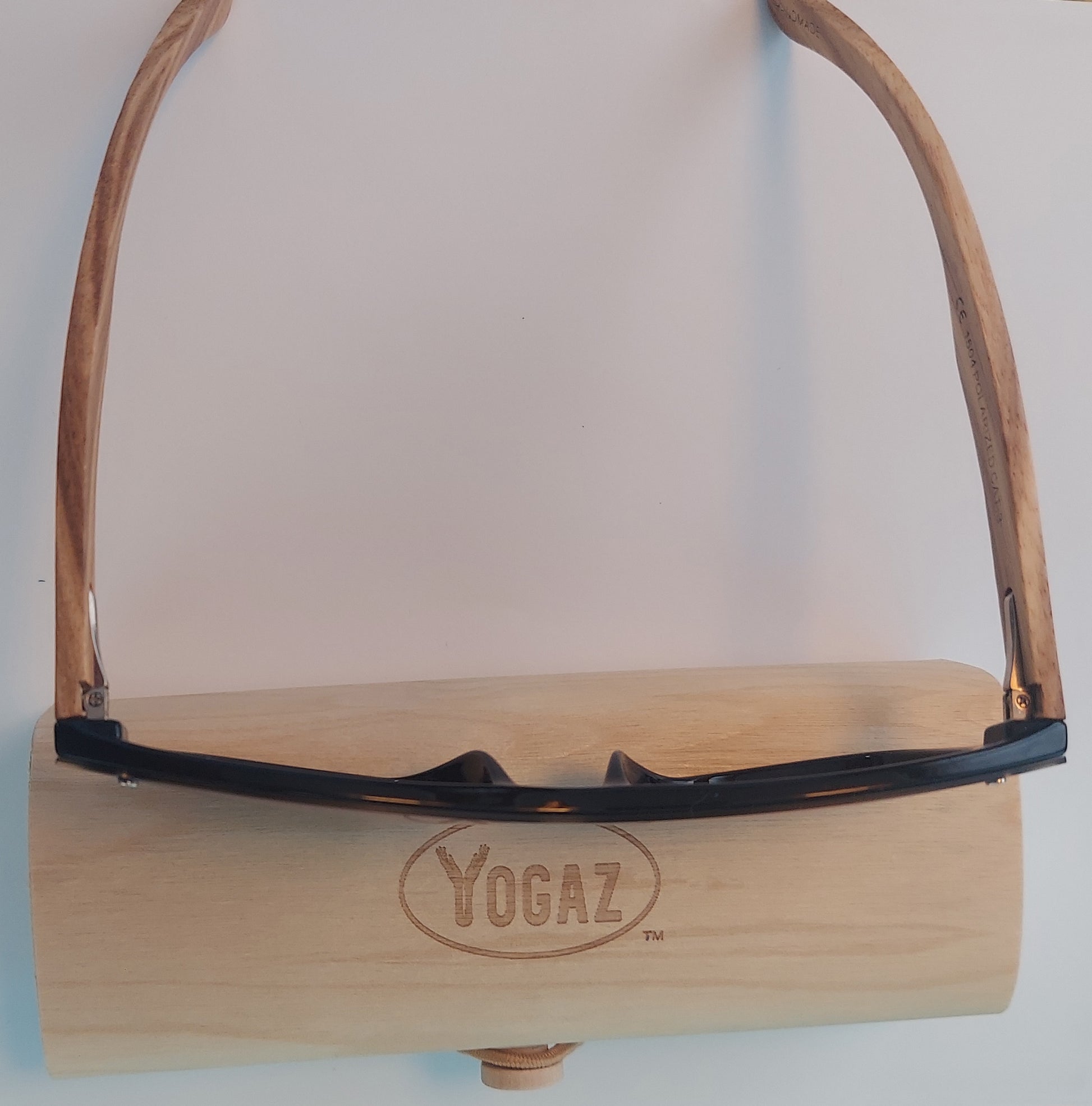 a wooden holder with a pair of glasses on top of it
