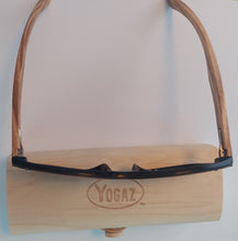 Load image into Gallery viewer, a wooden holder with a pair of glasses on top of it
