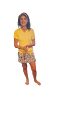 Load image into Gallery viewer, a woman in a yellow shirt and colorful shorts
