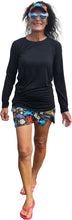 Load image into Gallery viewer, a woman in a black shirt and colorful shorts
