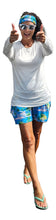Load image into Gallery viewer, a woman in blue shorts and a white shirt giving a thumbs up
