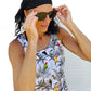 a woman wearing a black bandana and sunglasses