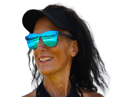a woman wearing sunglasses and a black hat