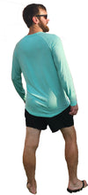 Load image into Gallery viewer, a man in a blue shirt and black shorts
