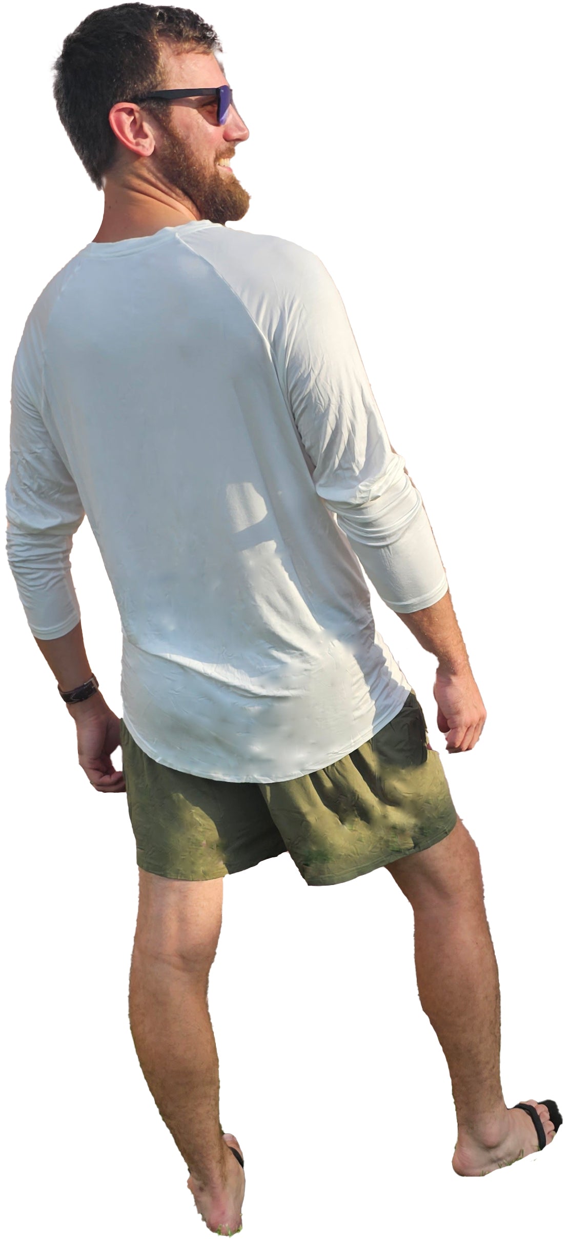 a man in a white shirt and green shorts