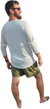 Load image into Gallery viewer, a man in a white shirt and green shorts

