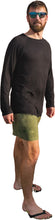 Load image into Gallery viewer, a man in a black shirt and green shorts

