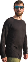Load image into Gallery viewer, a man in a black shirt and green pants
