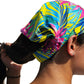 a woman with a colorful hair tie on her head