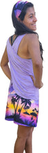 Load image into Gallery viewer, a woman wearing a purple top and shorts wearing a Lavender island wrap and matching bandana headband 
