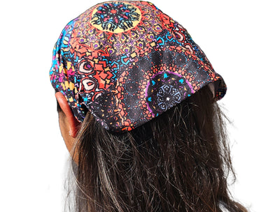 a close up of a person wearing a mandala headband 