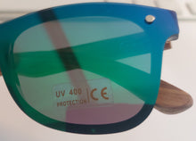 Load image into Gallery viewer, a pair of blue and green sunglasses sitting on top of a table
